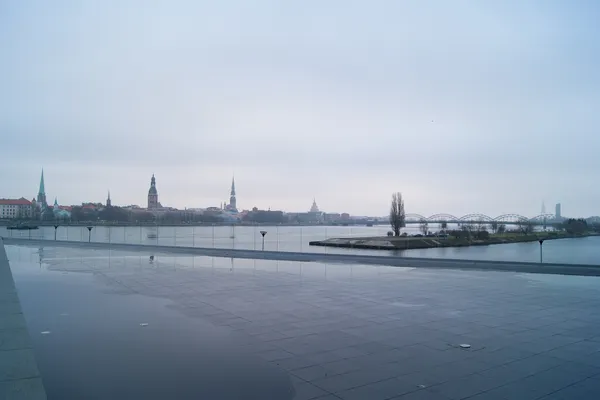 Riga Old Town skyline across the Daugava river, with church spires